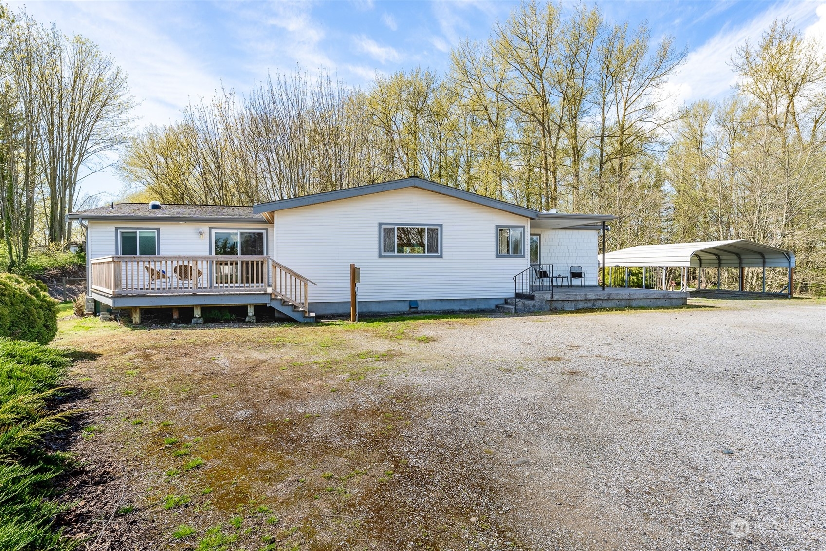 940 West Axton Road Ferndale, WA 98248 - Photo 1 of 40 a view of a house with a yard and sitting area