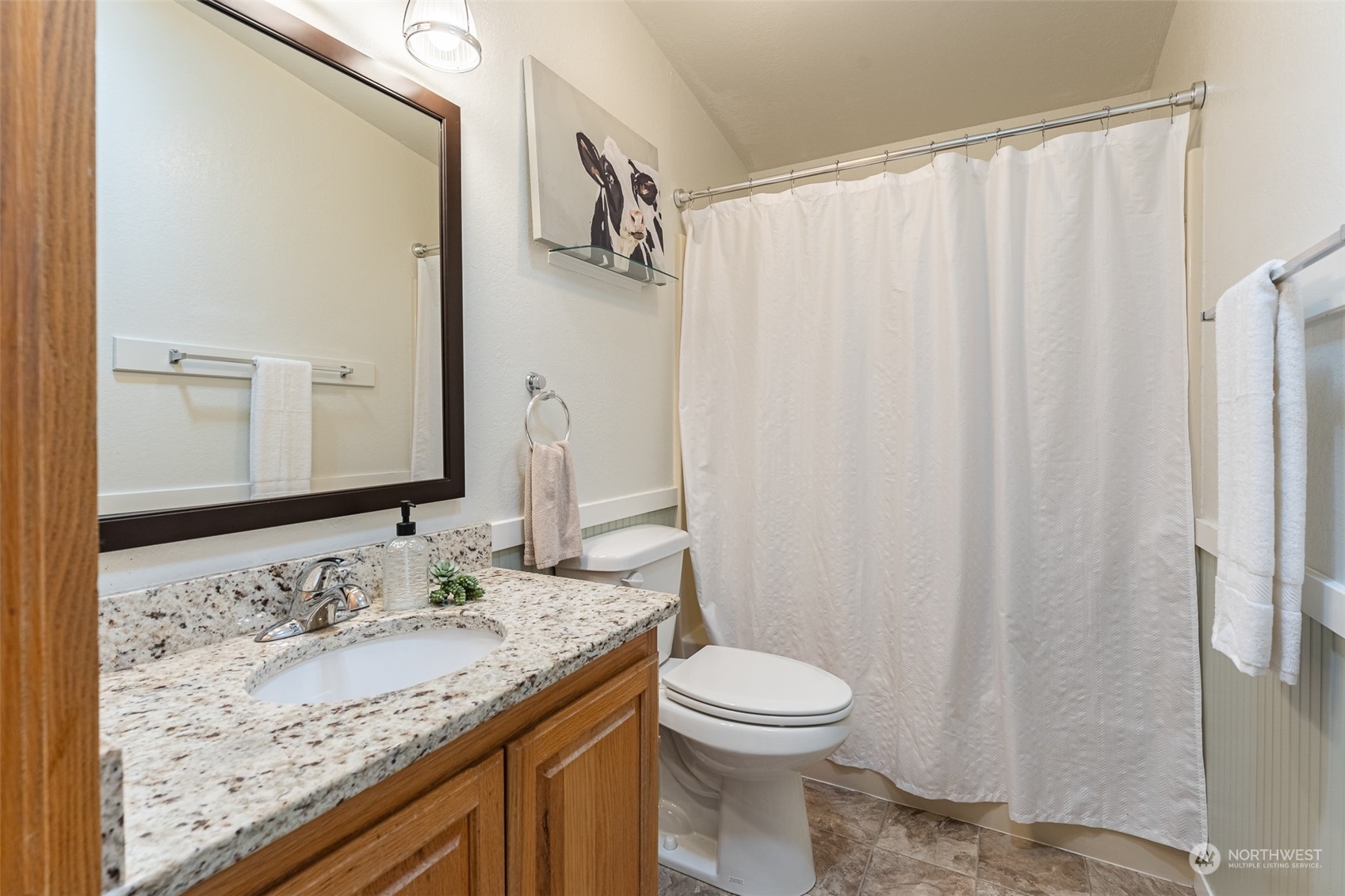 940 West Axton Road Ferndale, WA 98248 - Photo 14 of 40 a bathroom with a granite countertop sink and a mirror