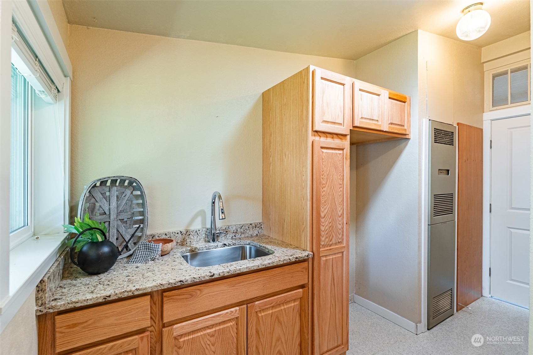 940 West Axton Road Ferndale, WA 98248 - Photo 16 of 40 a bathroom with a granite countertop sink and a mirror
