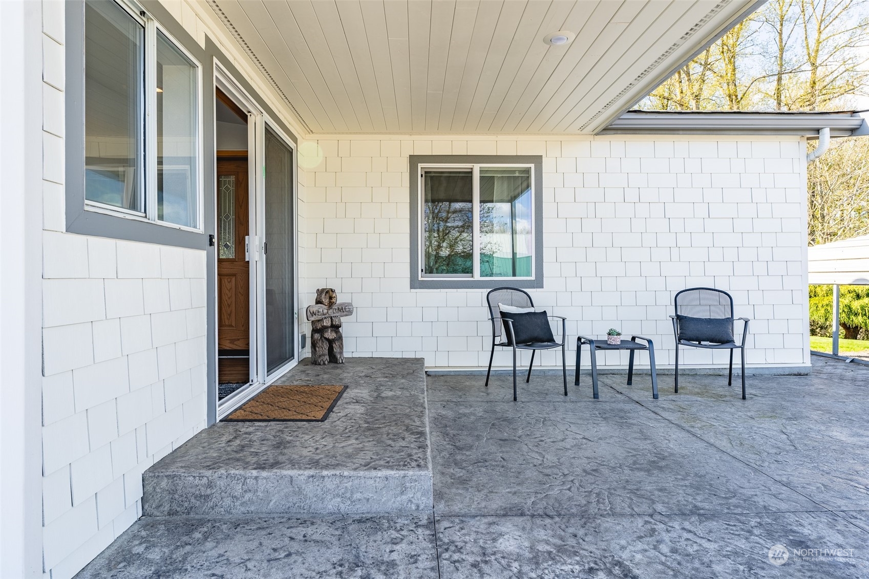 940 West Axton Road Ferndale, WA 98248 - Photo 17 of 40 a view of a porch with chairs and a yard