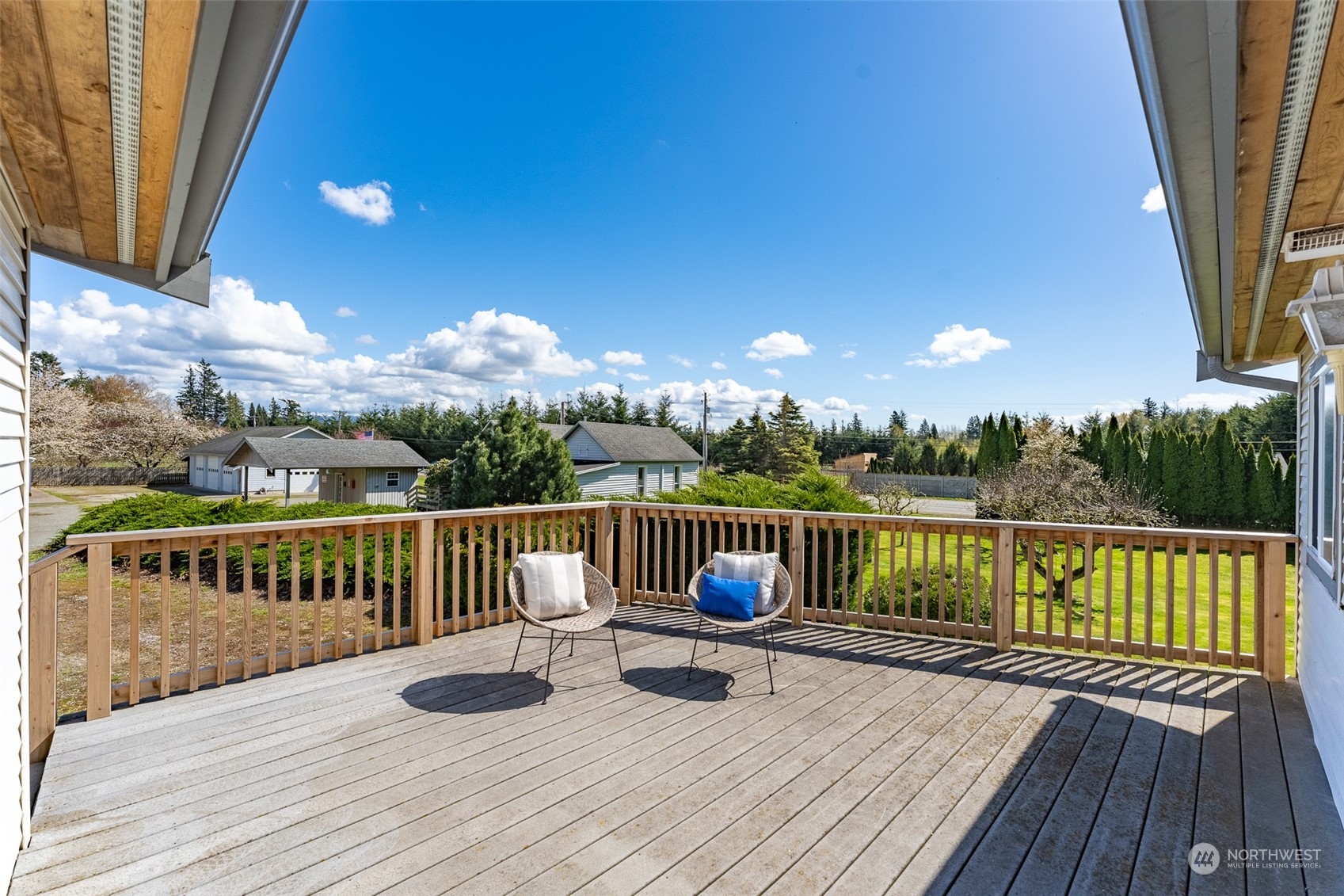 940 West Axton Road Ferndale, WA 98248 - Photo 18 of 40 a view of a balcony with wooden floor and iron fence