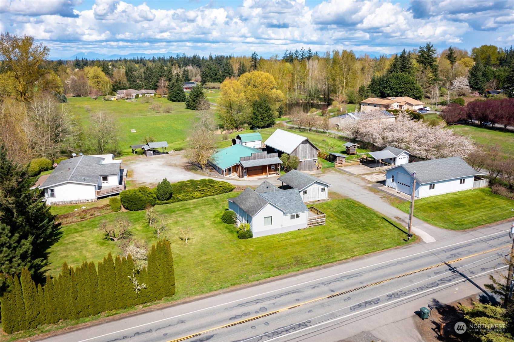 940 West Axton Road Ferndale, WA 98248 - Photo 2 of 40 a view of a lake with a table and chairs