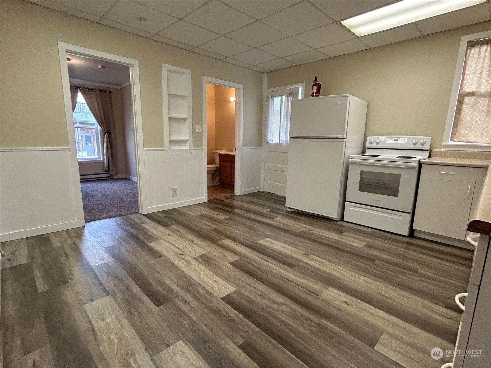 940 West Axton Road Ferndale, WA 98248 - Photo 21 of 40 a kitchen with a refrigerator and white cabinets