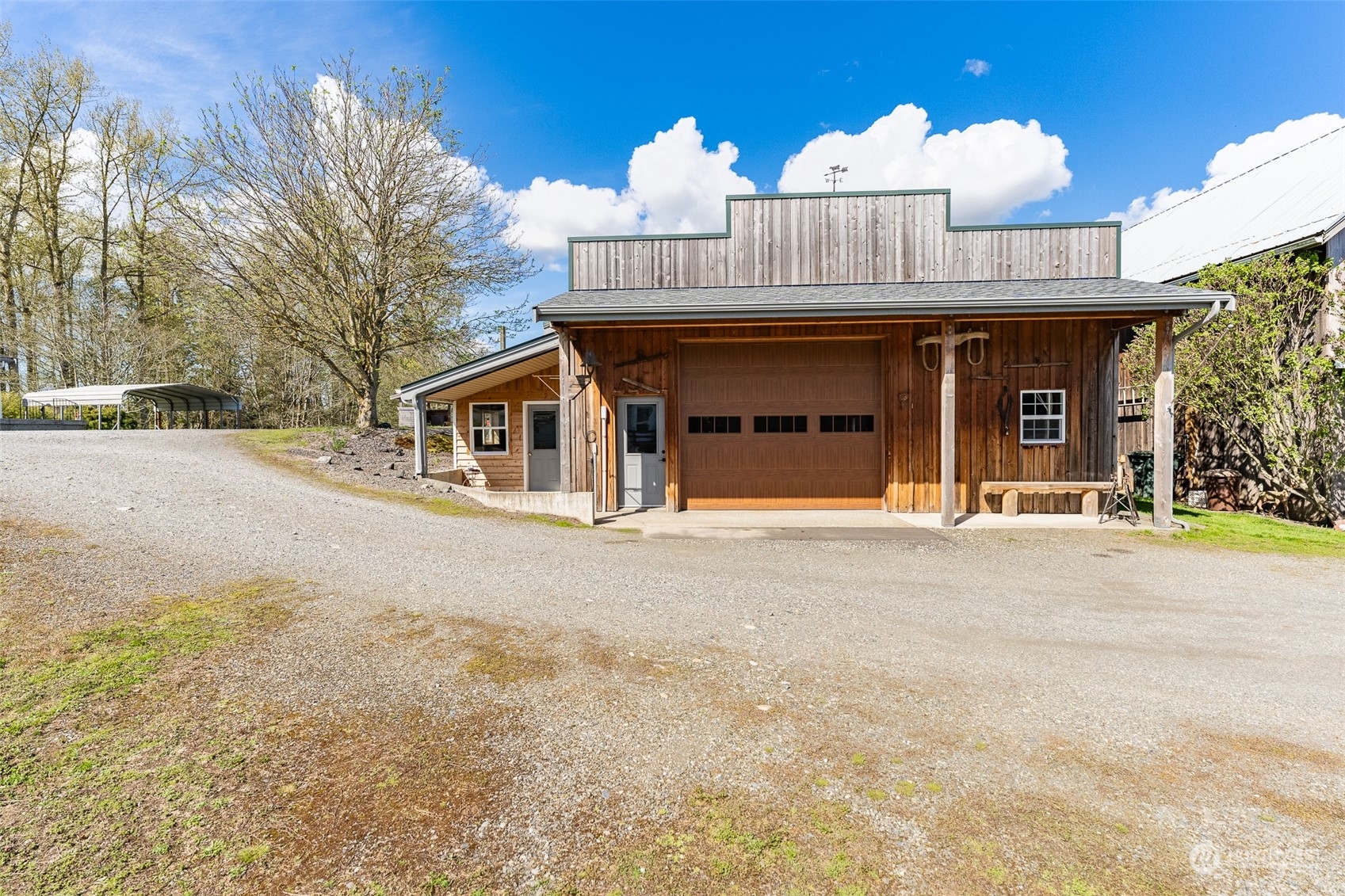 940 West Axton Road Ferndale, WA 98248 - Photo 23 of 40 a front view of a house with a yard and garage