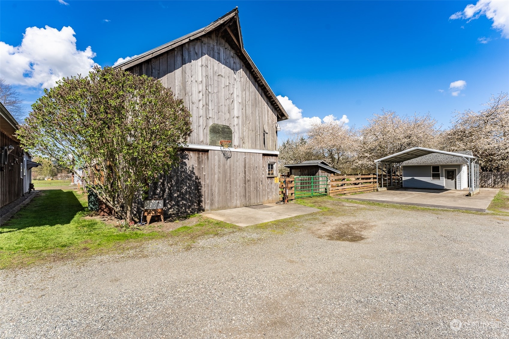 940 West Axton Road Ferndale, WA 98248 - Photo 32 of 40 a view of a house with a yard and garage
