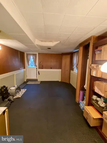 a view of game room with windows