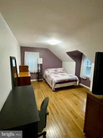 a bedroom with bed and window