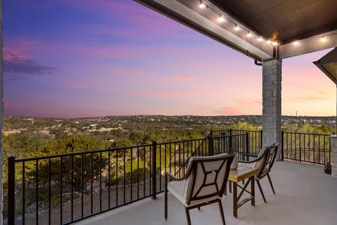 a dining room with furniture and a floor to ceiling window