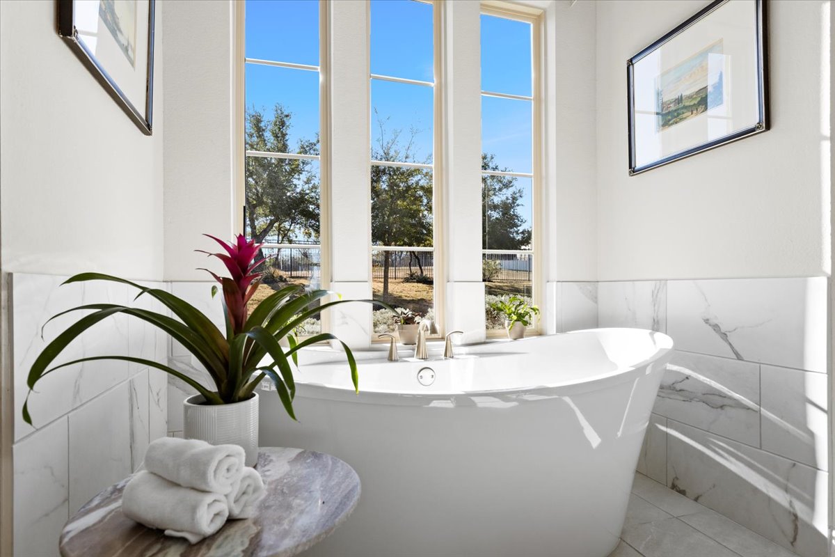 17825 Windecker Cove Dripping Springs, TX 78620 - Photo 20 of 39 a dining table with a potted plant