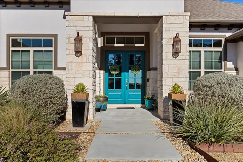 an aerial view of a house with a lake view
