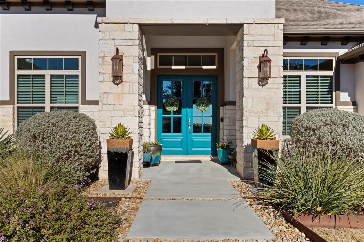 17825 Windecker Cove Dripping Springs, TX 78620 - Photo 37 of 39 front view of a house with a yard