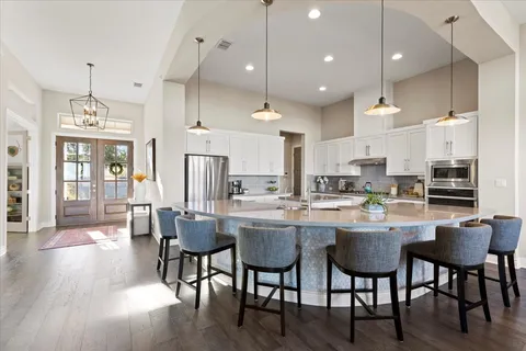 a kitchen with lots of counter top space and living room