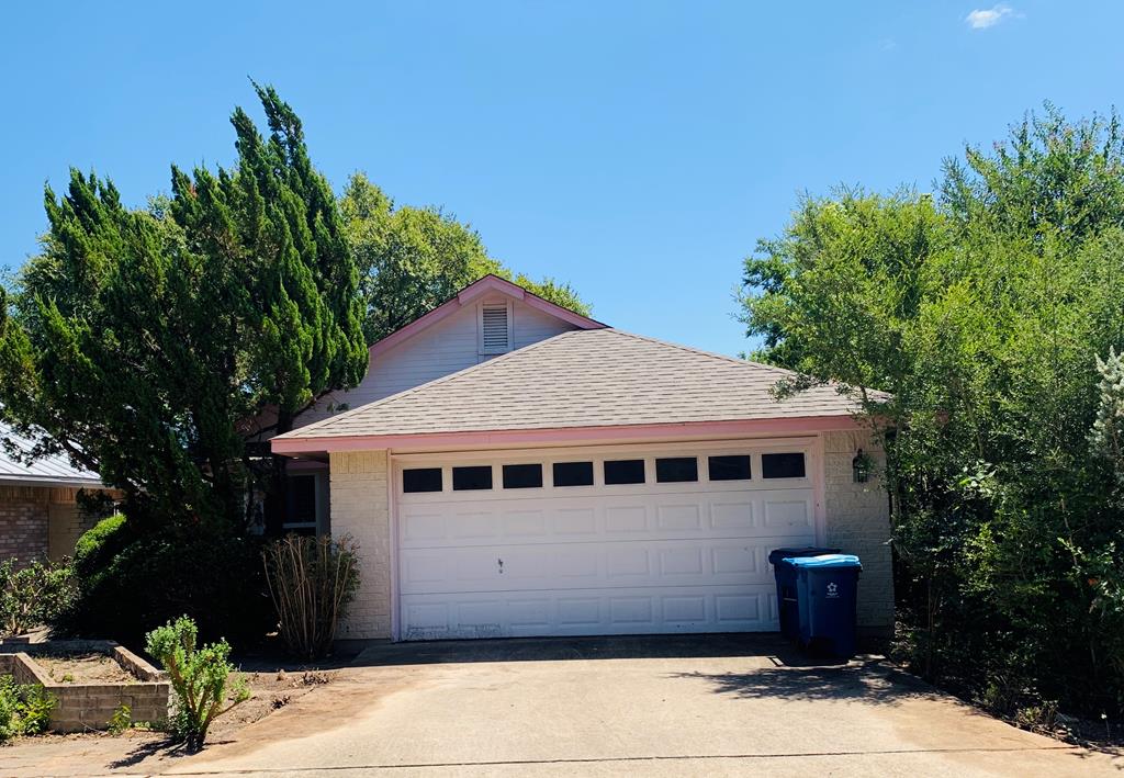 a view of house with yard
