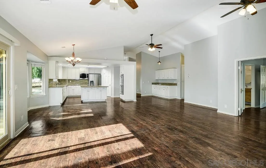 14525 Millards Ranch Lane Poway, CA 92064 - Photo 12 of 29 a large kitchen with cabinets and wooden floor