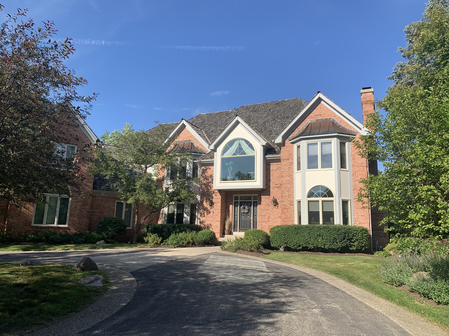 5801 Port Clinton Road Long Grove, IL 60047 - Photo 2 of 38 a front view of a residential houses with yard and green space