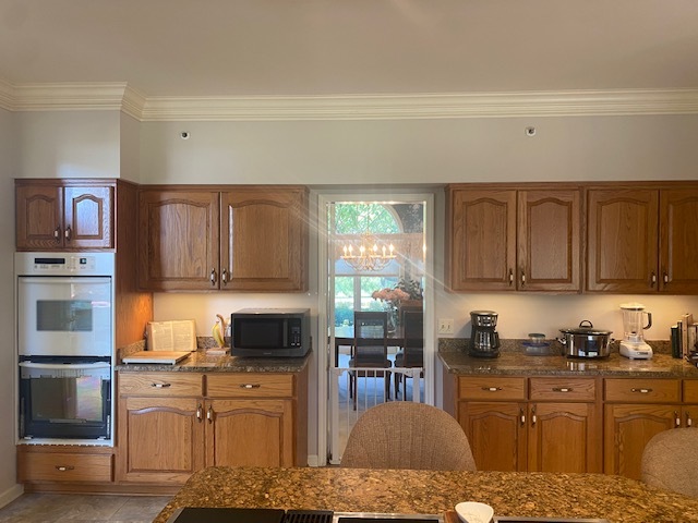 5801 Port Clinton Road Long Grove, IL 60047 - Photo 7 of 38 a kitchen with stainless steel appliances granite countertop a refrigerator stove top oven and sink