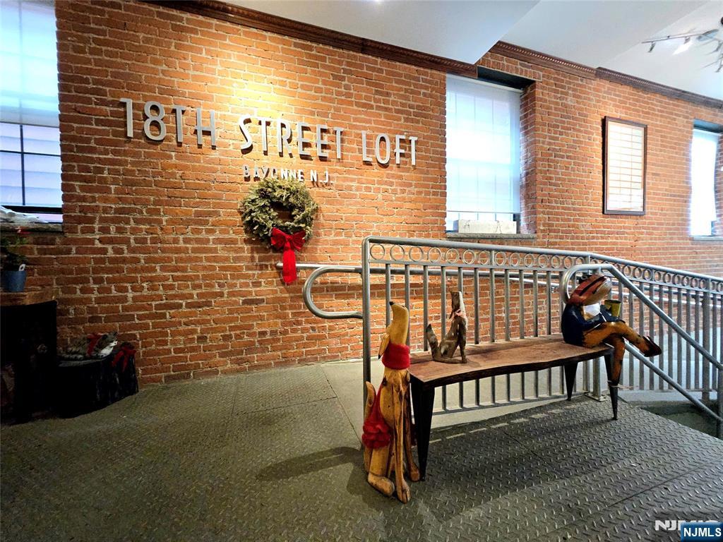 9 East 18th Street, Unit 3A Bayonne, NJ 07002 - Photo 3 of 4 a view of a porch with a bench