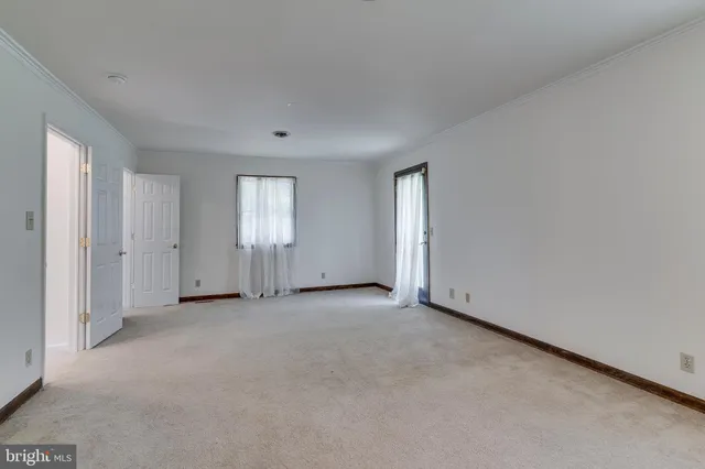 an empty room with windows