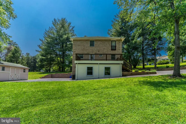 a house view with a sitting space and garden