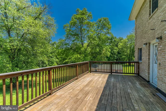 a view of a balcony with wooden floor