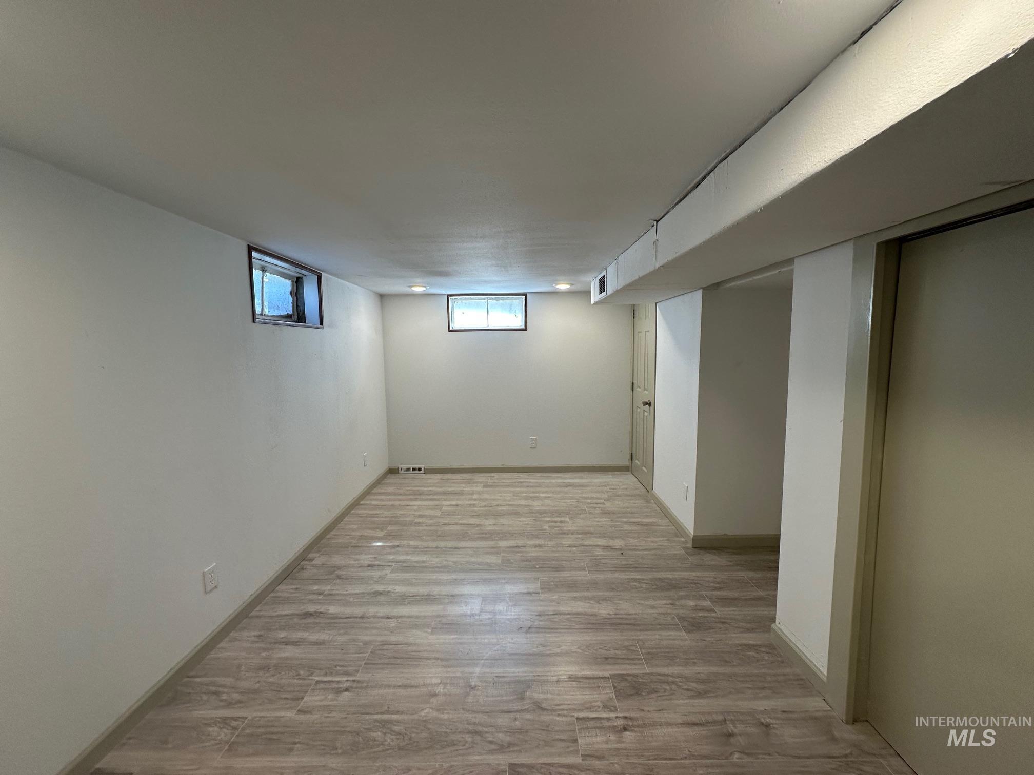 264 Southwest 10th Avenue Ontario, OR 97914 - Photo 15 of 26 Below grade area featuring wood finished floors and baseboards