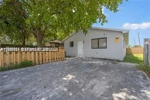 a view of backyard and tree