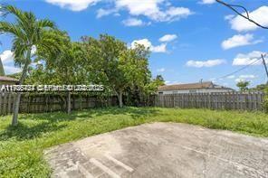 303 Northwest 7th Street, Unit 12 Hallandale Beach, FL 33009 - Photo 3 of 18 a view of a backyard