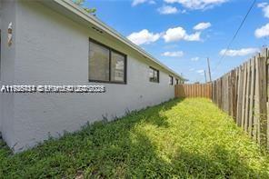 303 Northwest 7th Street, Unit 12 Hallandale Beach, FL 33009 - Photo 6 of 18 a house view with a backyard space
