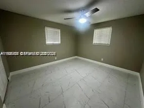 a bathroom with a double vanity sink toilet and shower