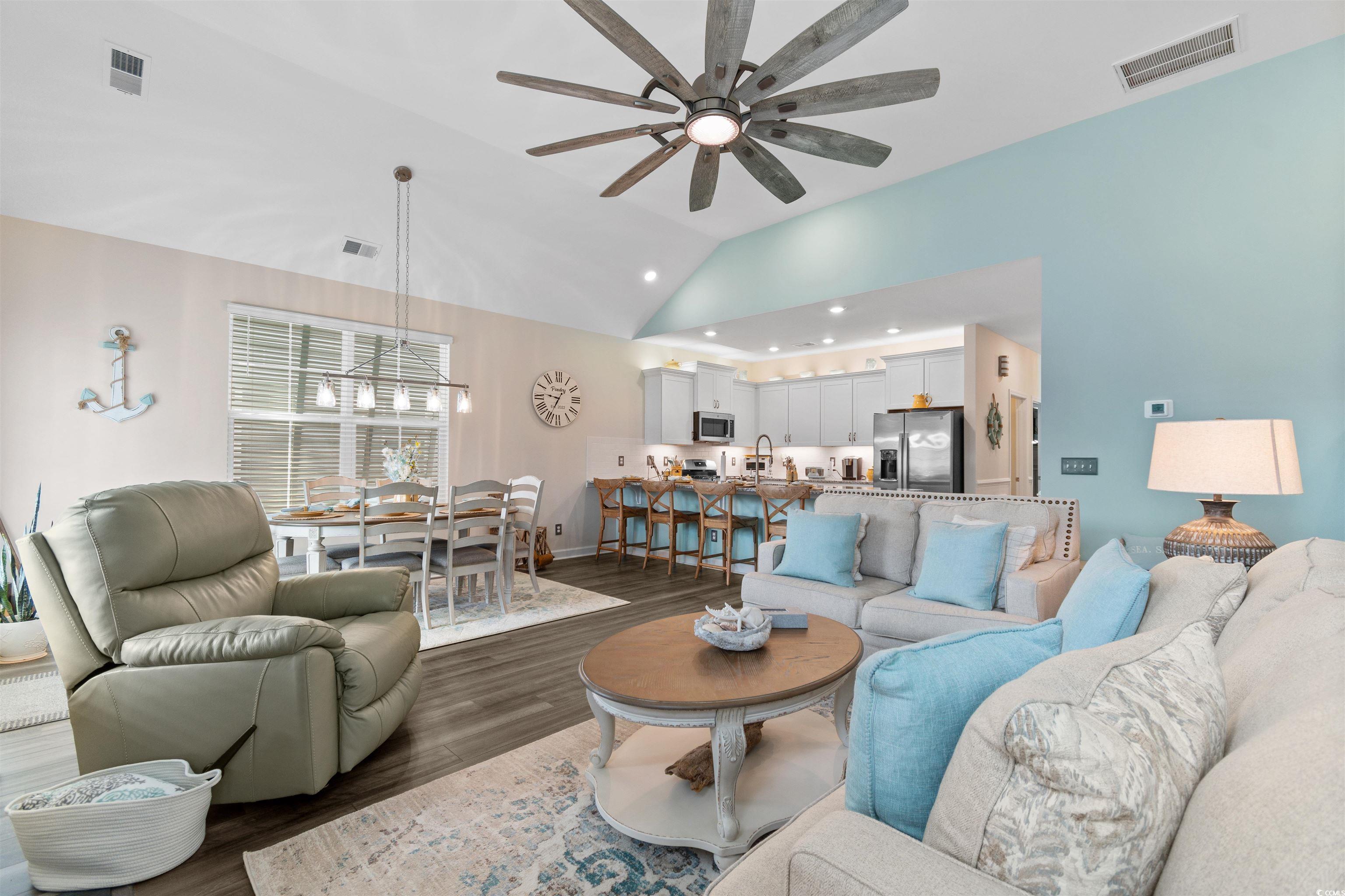 240 Sundew Loop Little River, SC 29566 - Photo 12 of 40 Living area with a ceiling fan, vaulted ceiling, dark wood-style floors, recessed lighting, and a chandelier