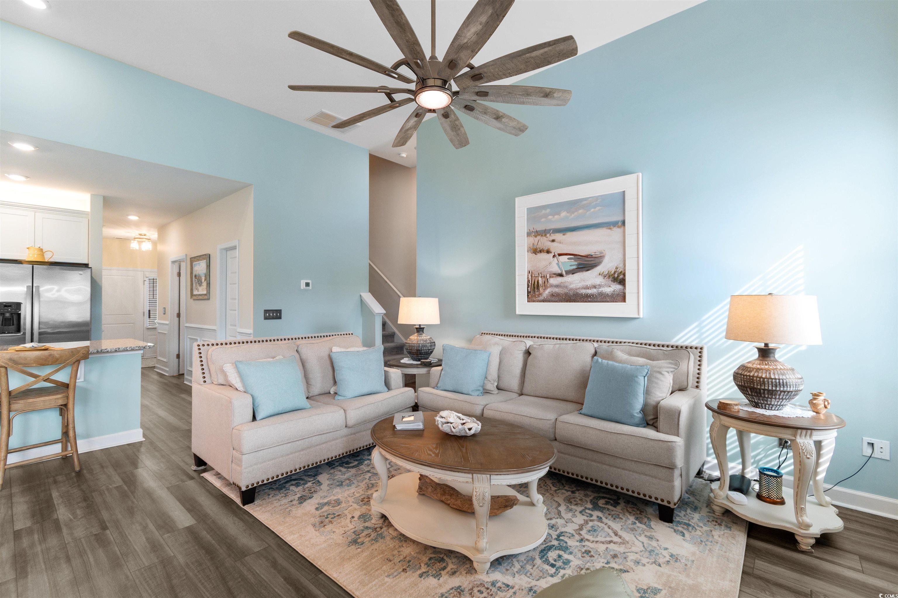 240 Sundew Loop Little River, SC 29566 - Photo 13 of 40 Living room featuring dark wood-style flooring, a ceiling fan, recessed lighting, and stairway