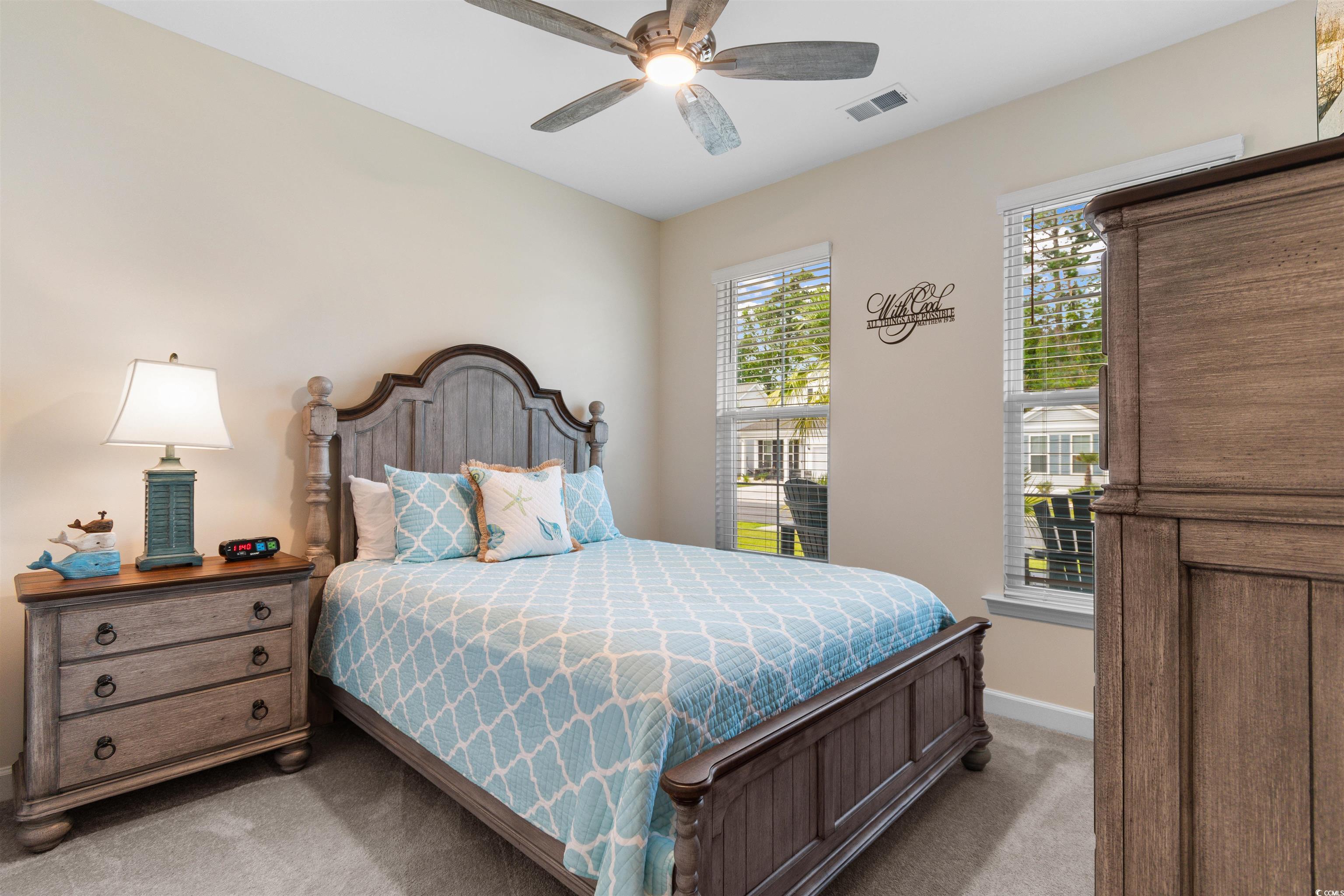 240 Sundew Loop Little River, SC 29566 - Photo 19 of 40 Bedroom with light colored carpet and ceiling fan