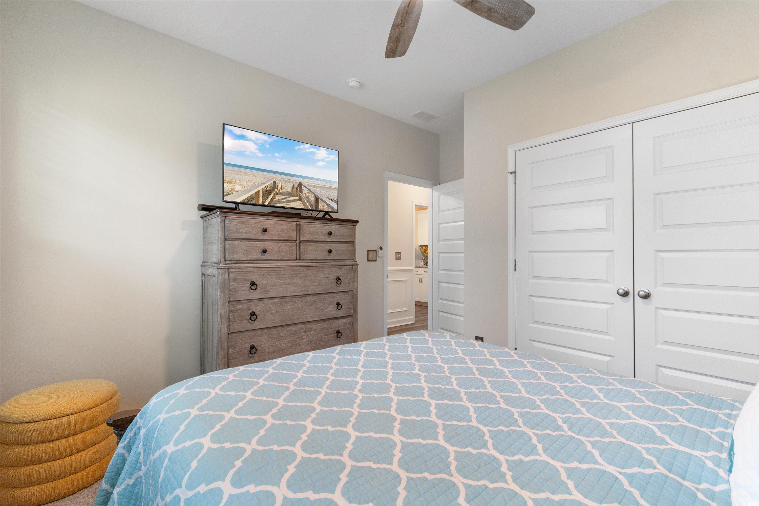 240 Sundew Loop Little River, SC 29566 - Photo 20 of 40 Bedroom featuring a closet and ceiling fan