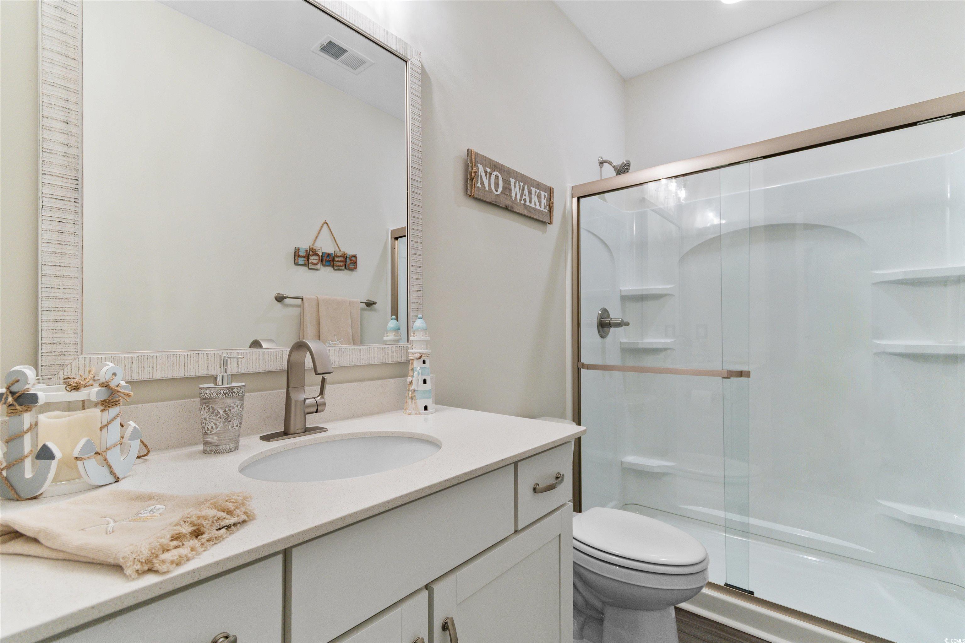 240 Sundew Loop Little River, SC 29566 - Photo 21 of 40 Full bathroom with vanity and a stall shower