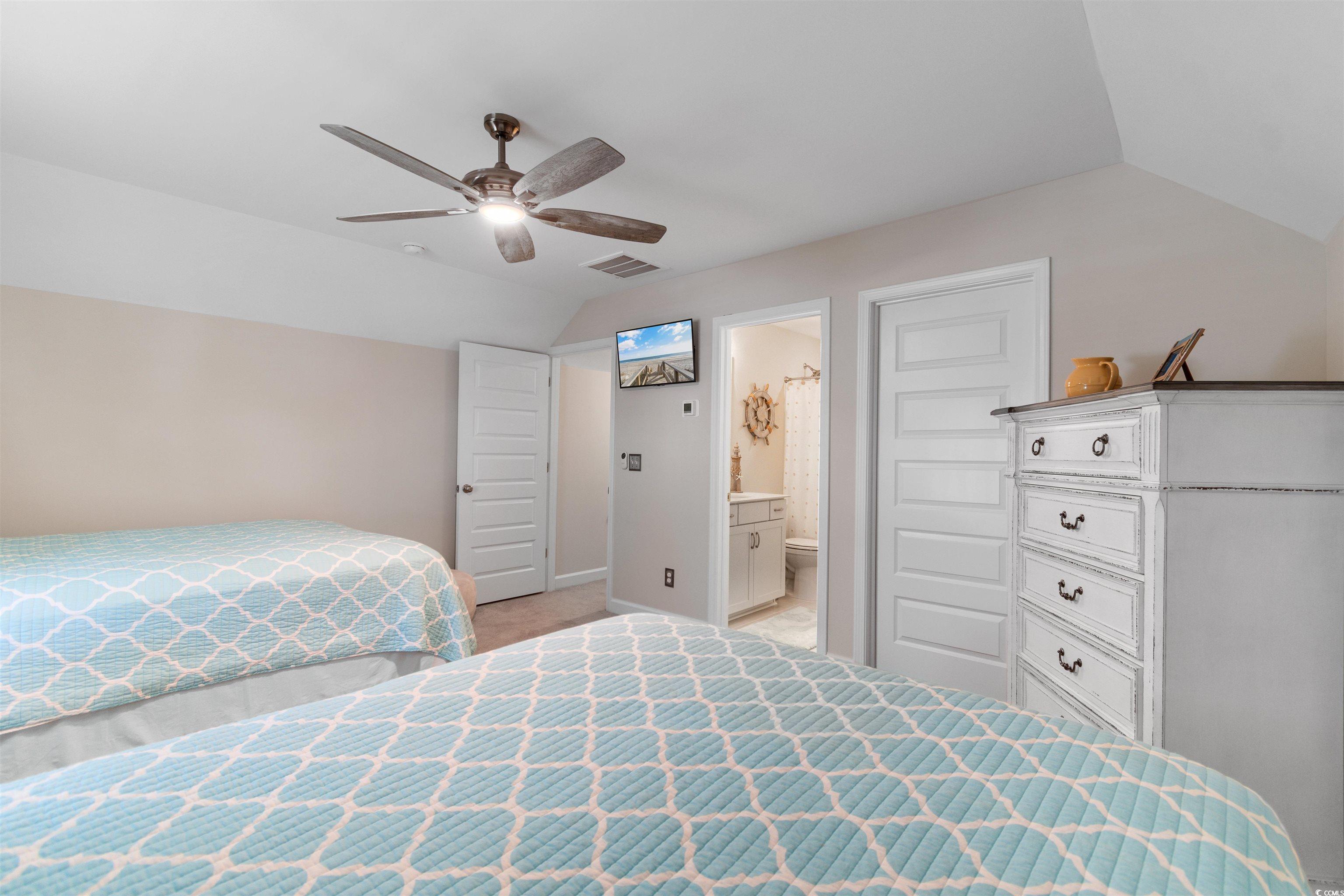 240 Sundew Loop Little River, SC 29566 - Photo 24 of 40 Bedroom featuring lofted ceiling, light carpet, ceiling fan, and ensuite bath