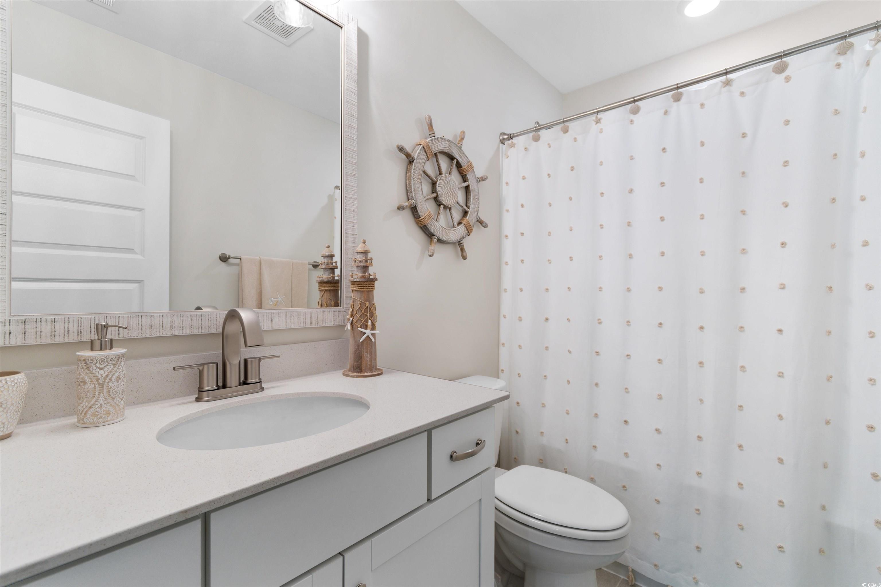 240 Sundew Loop Little River, SC 29566 - Photo 25 of 40 Full bathroom featuring vanity and curtained shower