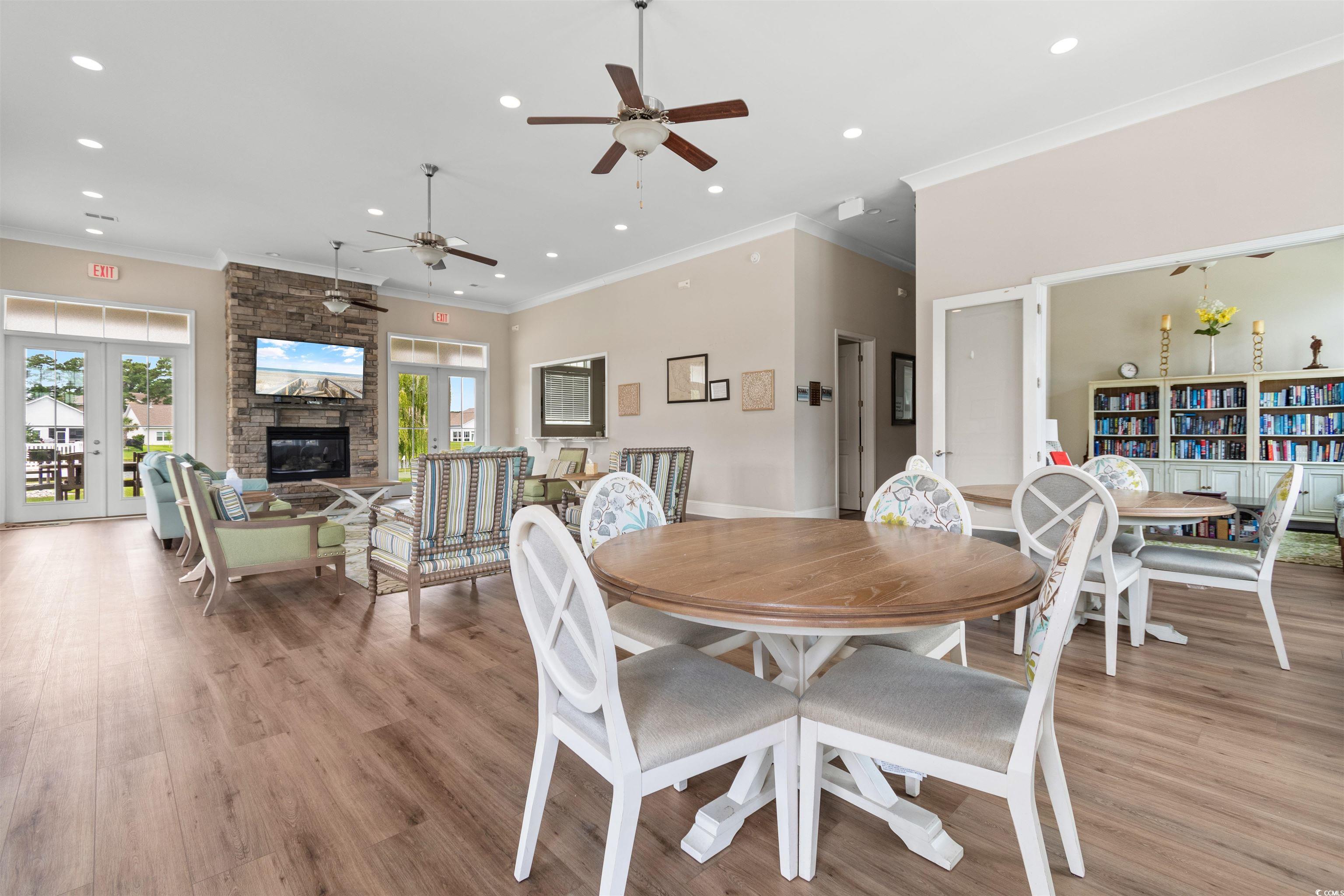 240 Sundew Loop Little River, SC 29566 - Photo 30 of 40 Dining area featuring a ceiling fan, recessed lighting, light wood-style floors, ornamental molding, and french doors