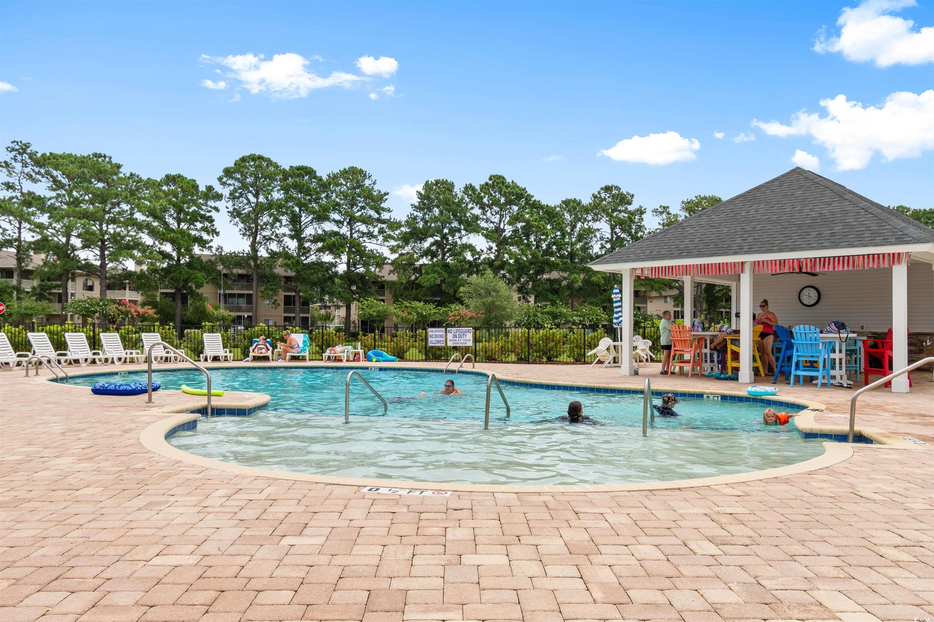 240 Sundew Loop Little River, SC 29566 - Photo 32 of 40 Community pool featuring a patio area and a gazebo