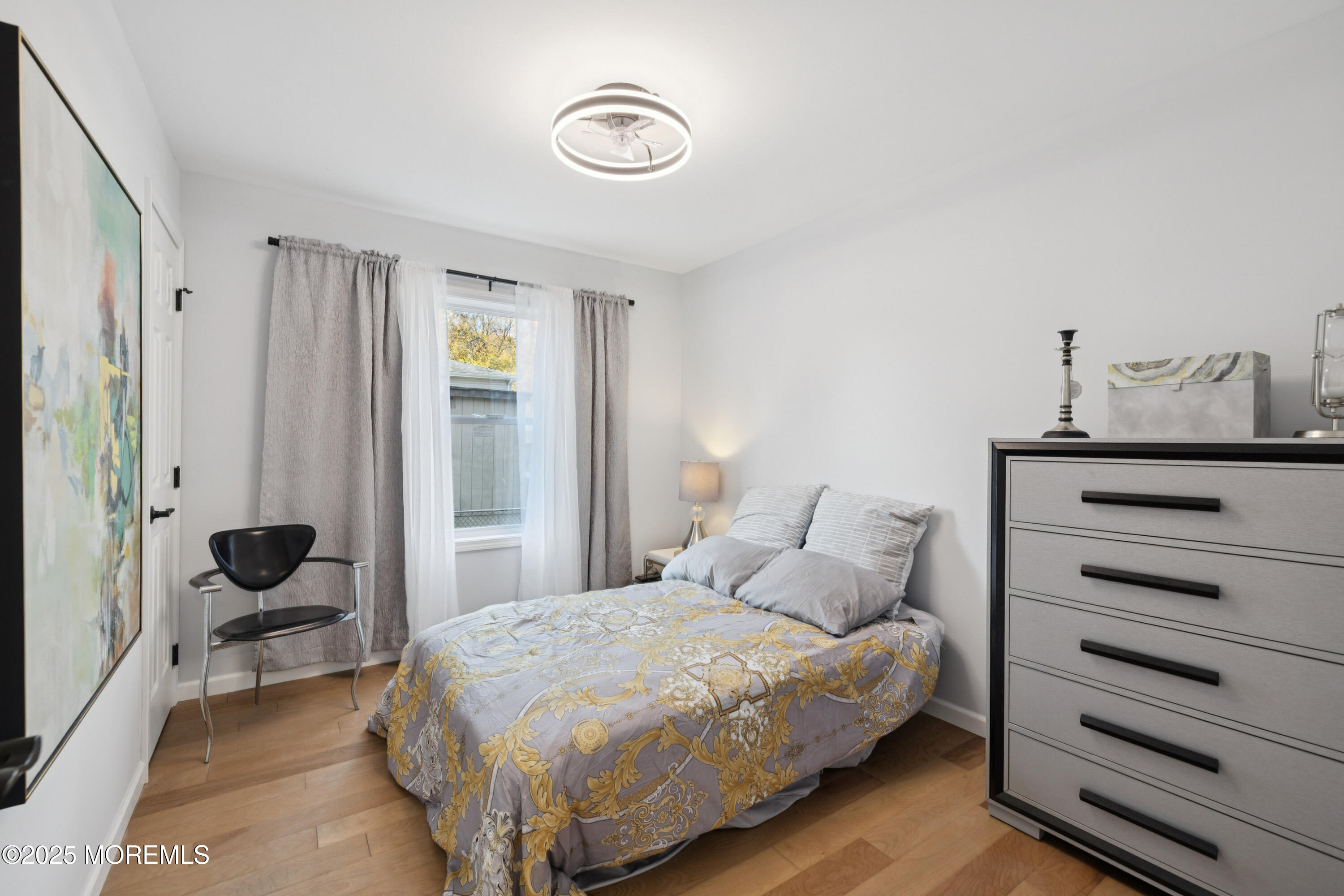 1569 Holly Road North Brunswick, NJ 08902 - Photo 11 of 29 a bedroom with a bed and a cabinets