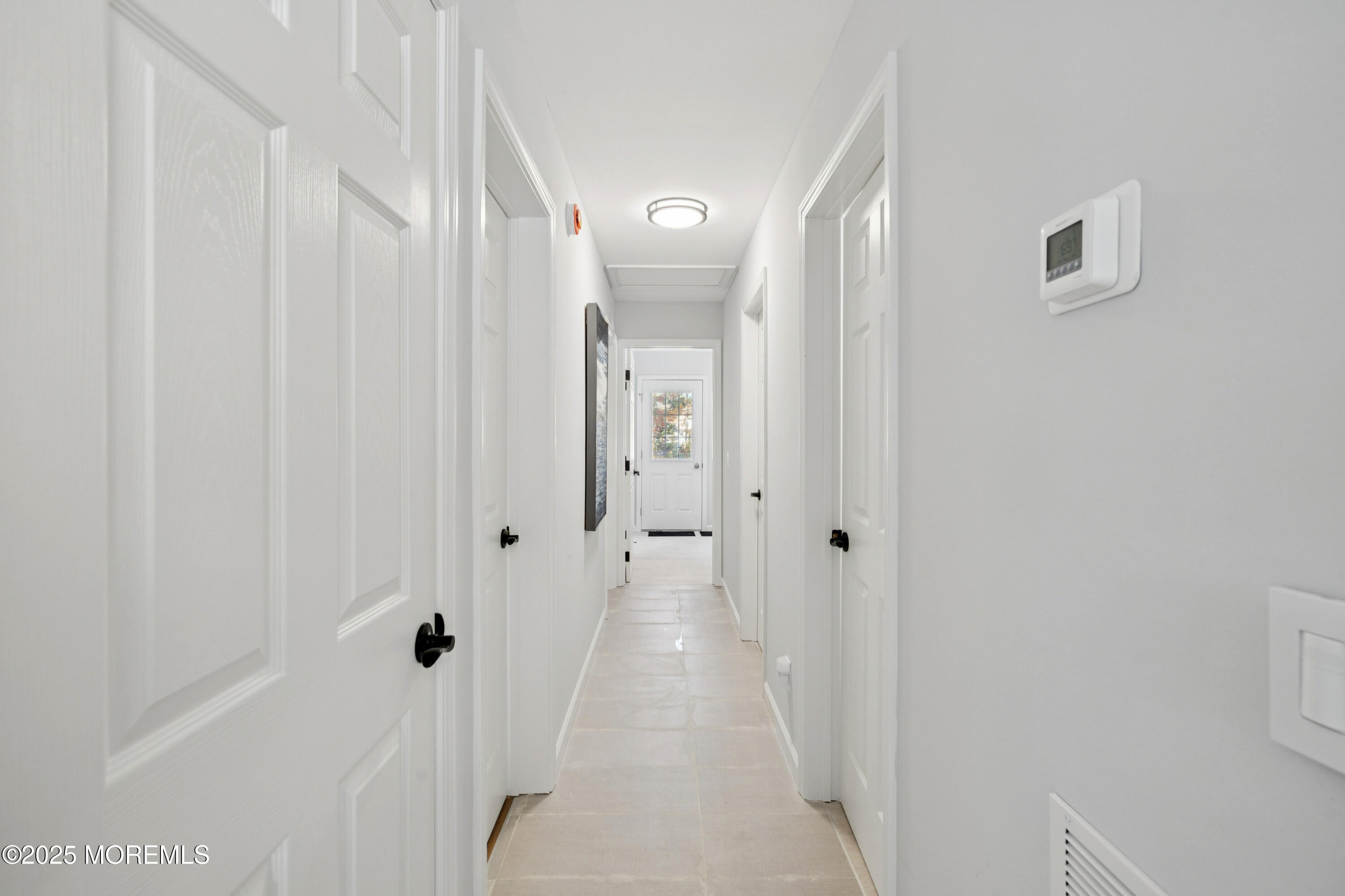 1569 Holly Road North Brunswick, NJ 08902 - Photo 12 of 29 a view of a hallway with wooden floor and closet area