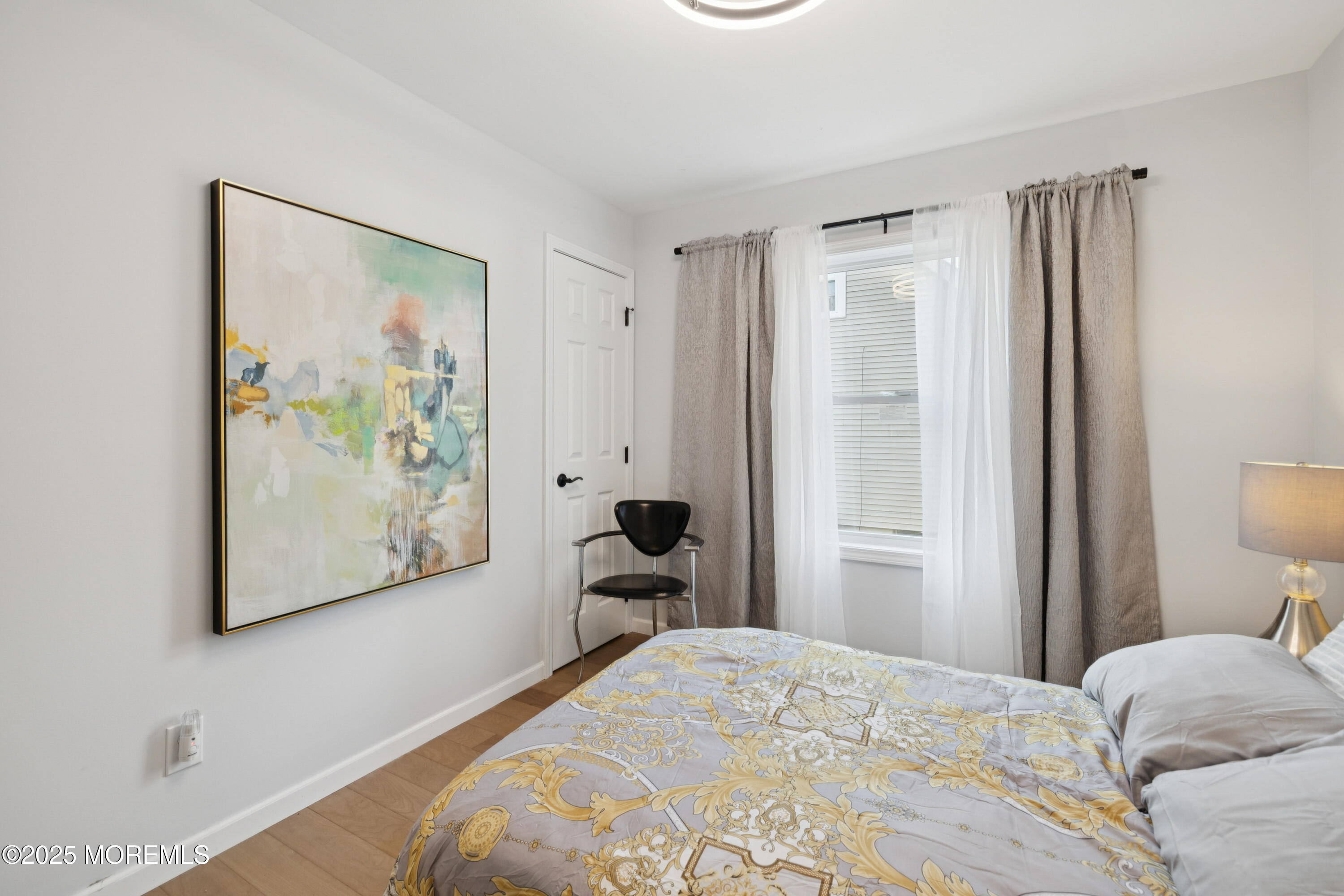 1569 Holly Road North Brunswick, NJ 08902 - Photo 13 of 29 a bedroom with a bed and a painting on the wall