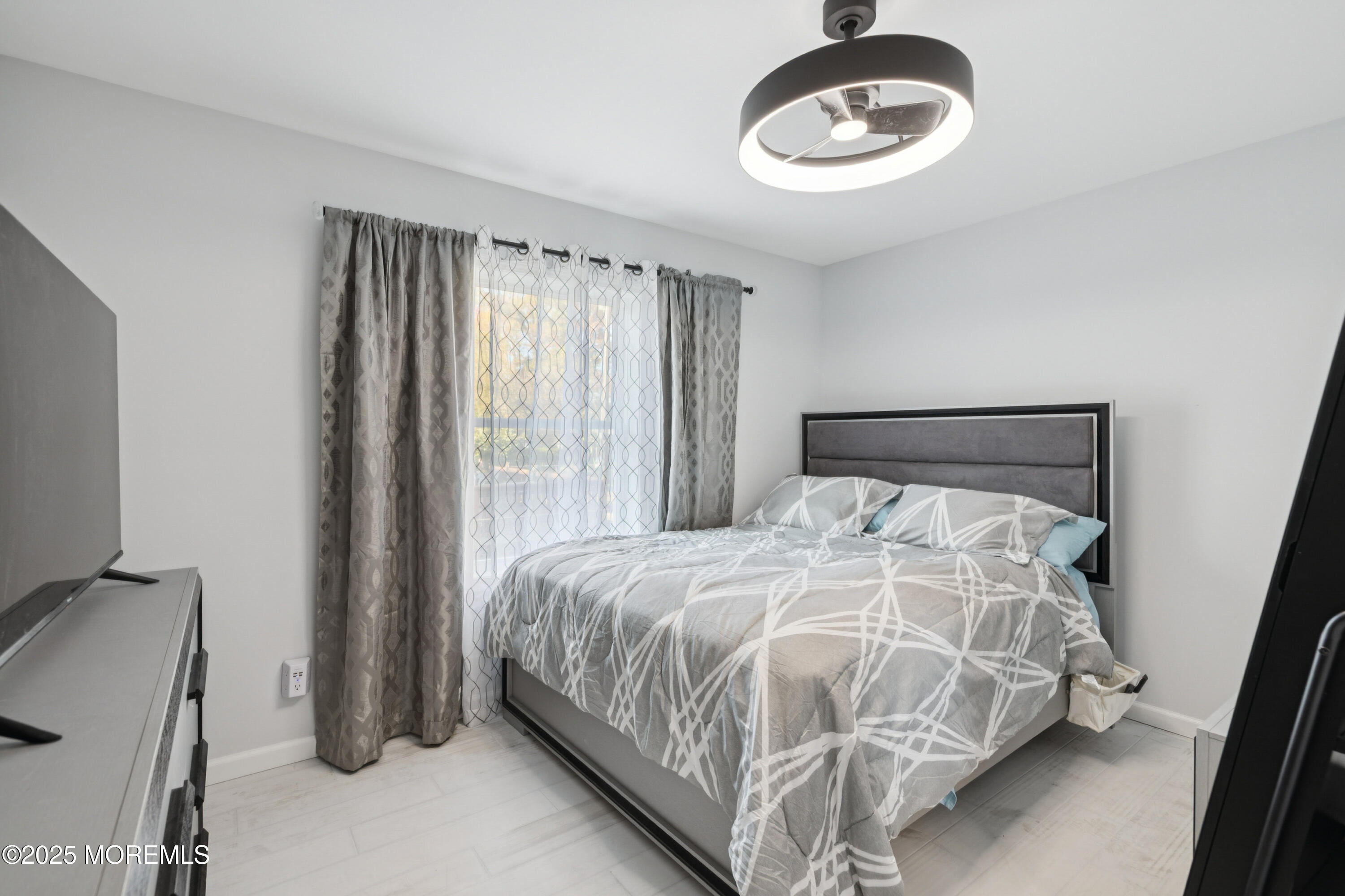 1569 Holly Road North Brunswick, NJ 08902 - Photo 16 of 29 a bedroom with a bed and a window