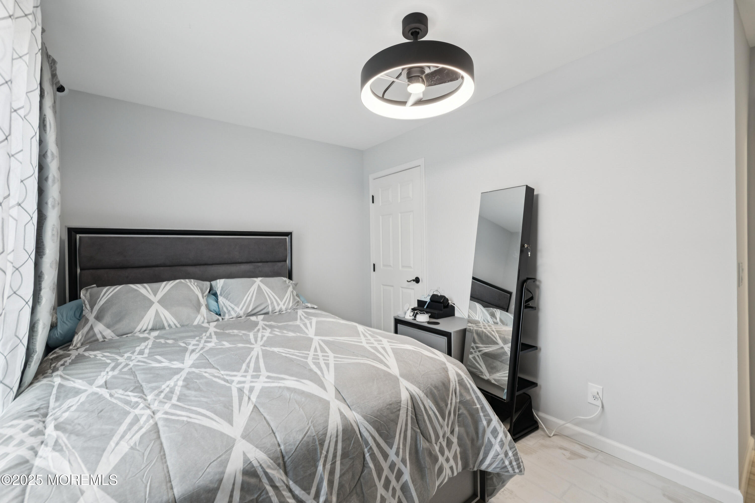 1569 Holly Road North Brunswick, NJ 08902 - Photo 18 of 29 a bedroom with a bed and a window