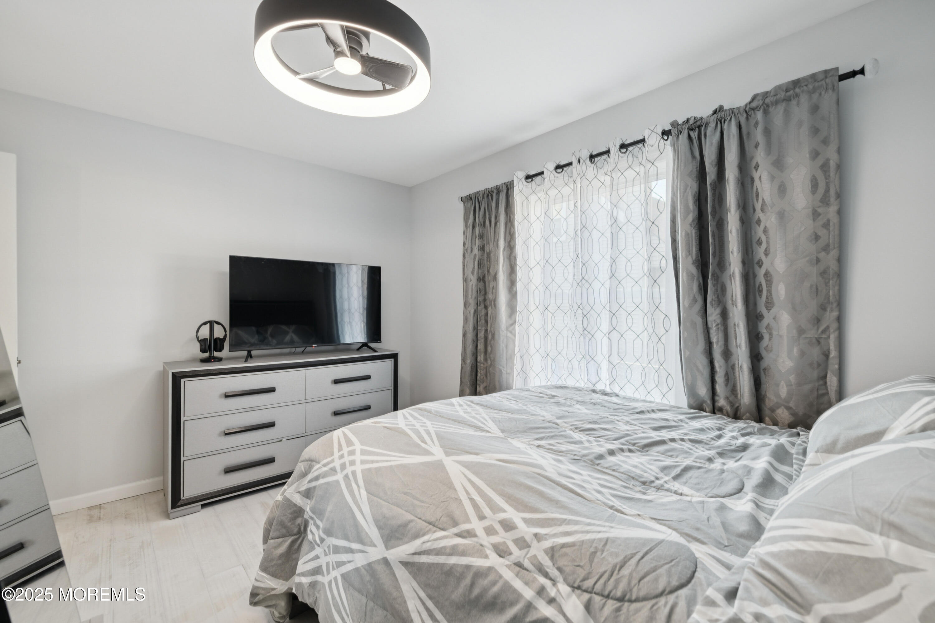 1569 Holly Road North Brunswick, NJ 08902 - Photo 19 of 29 a bedroom with a bed and a television