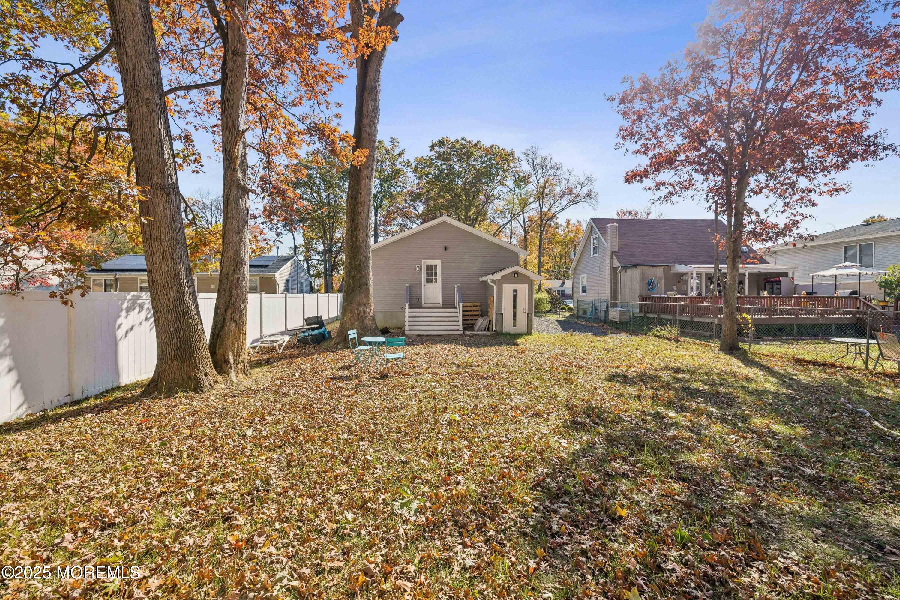 1569 Holly Road North Brunswick, NJ 08902 - Photo 26 of 29 a house with a large tree in front of it
