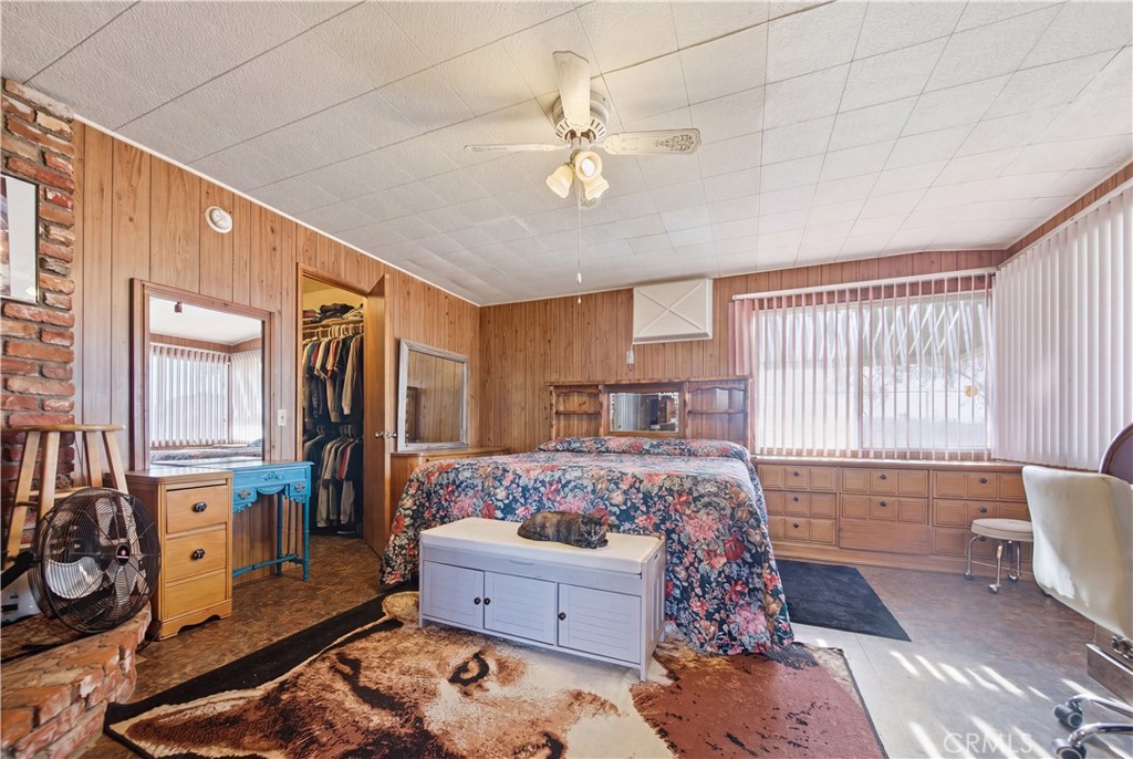 60153 Stearman Road Landers, CA 92285 - Photo 11 of 26 a bed room with a bed and a couch