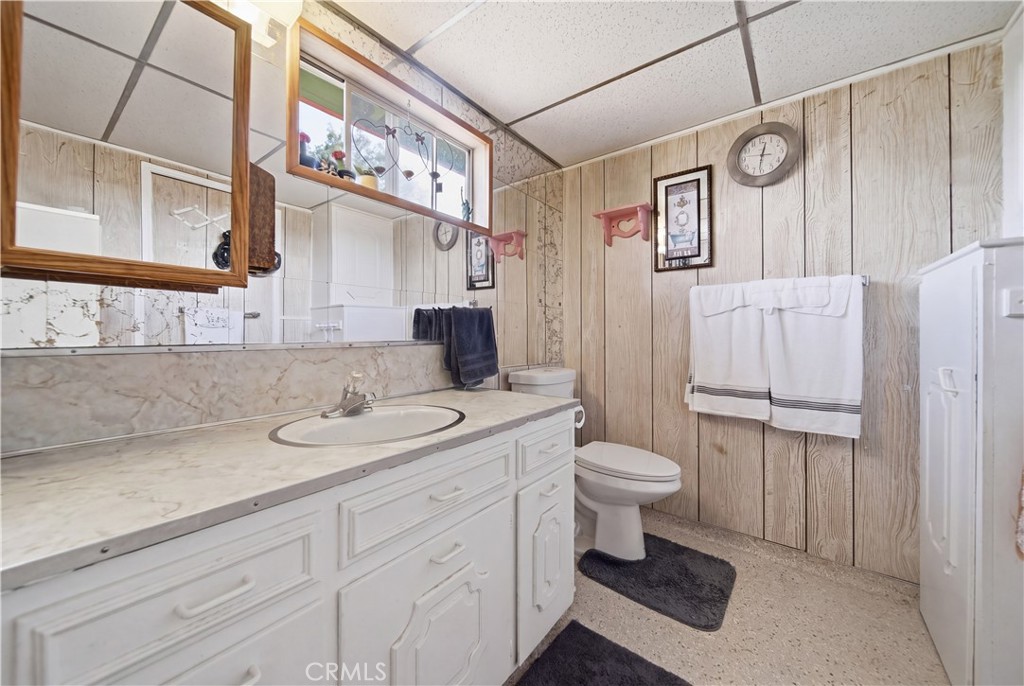 60153 Stearman Road Landers, CA 92285 - Photo 13 of 26 a bathroom with a sink a toilet and a mirror