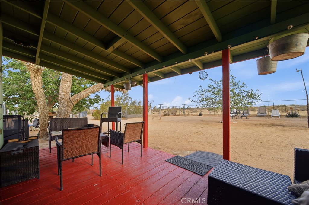 60153 Stearman Road Landers, CA 92285 - Photo 3 of 26 a view of a swimming pool with outdoor seating