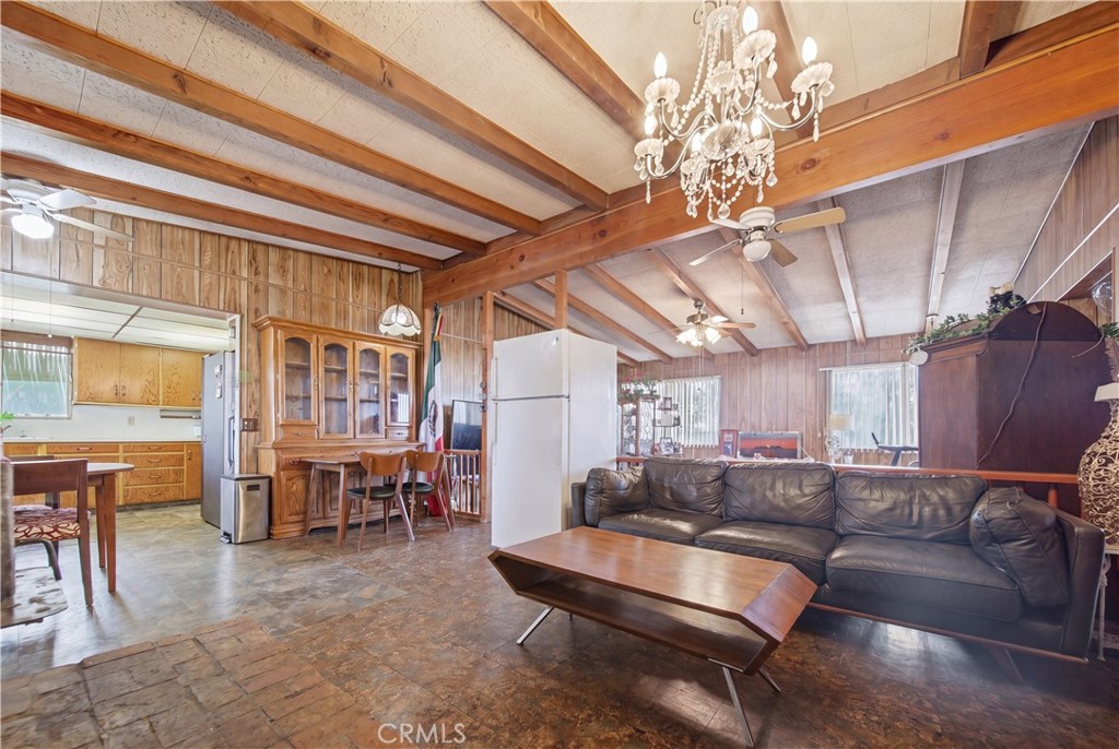 60153 Stearman Road Landers, CA 92285 - Photo 7 of 26 a living room with furniture and a chandelier