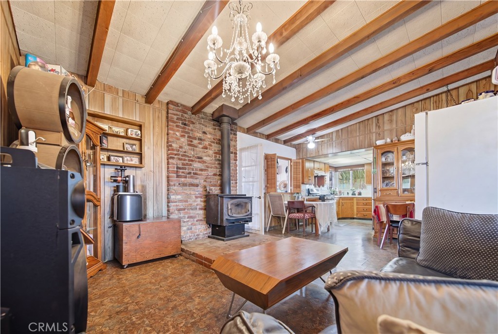 60153 Stearman Road Landers, CA 92285 - Photo 8 of 26 a living room with furniture and a chandelier